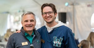 Recent Graduate with Provost at alumni event