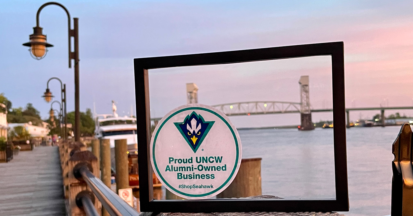 Downtown Wilmington with "Proud UNCW Alumni-Owned Business" decal displayed