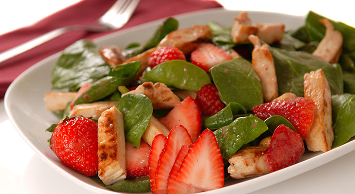 Stock photo of BBQ chicken and strawberry salad