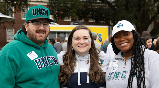 Alumni in front of PT's Food Truck at TEALgate