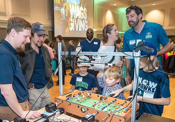 Family playing Foosball at Champagne Brunch