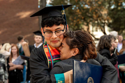 Grad hugs family