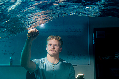 student at wave flume lab