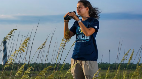 Allie Best with binoculars