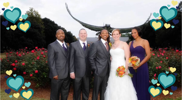 A wedding photo of Katelynn Garner-Cooke and Gregory Cooke in front of the UNCW Seahawk statue