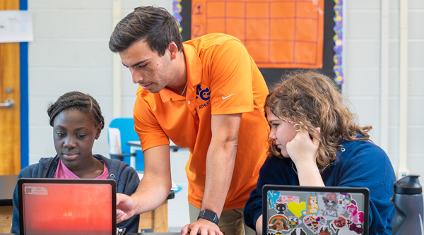 Kevin with students