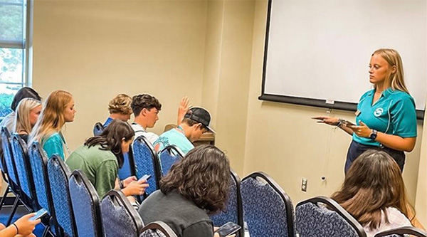 Shelby Kennedy '24 leading student orientation. 