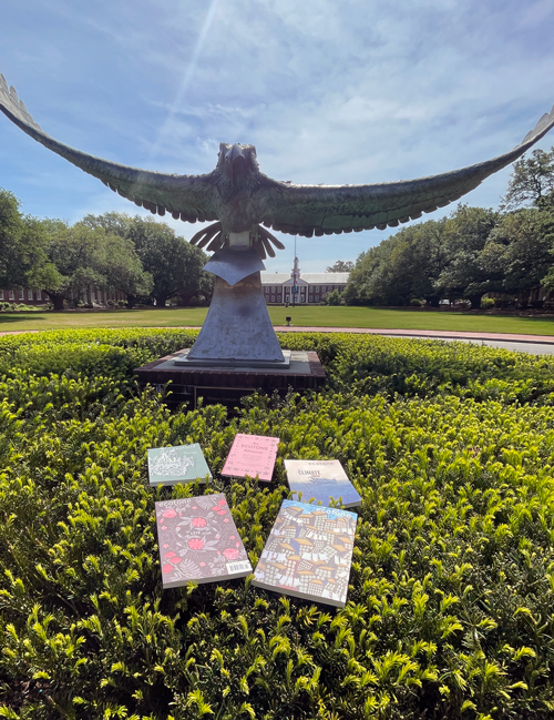 books on bushes by Seahawk statue