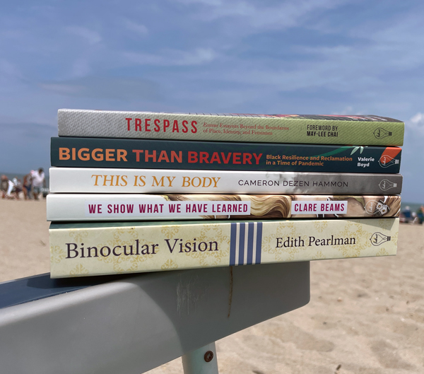 stack of books on beach chair