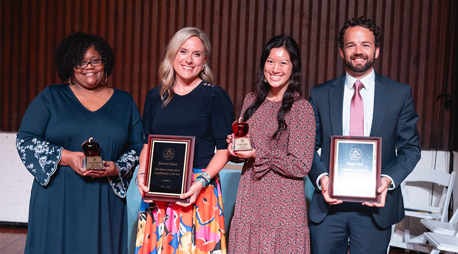 Latasha Howard-Mott, Hannah Moon, Sydney Kong, and Brent Hall holding their Educators of the Year awards