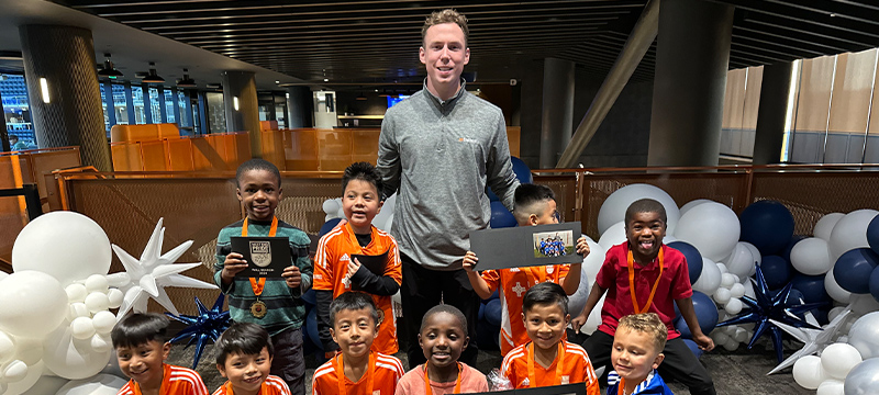 Jack Mehrtens with a group of Children