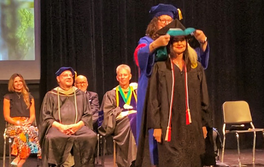 Lorna Ricotta '22M on stage at Commencement.