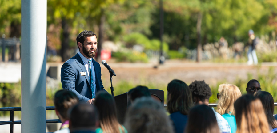 Robert Fensom speaks to crowd on UNCW campus