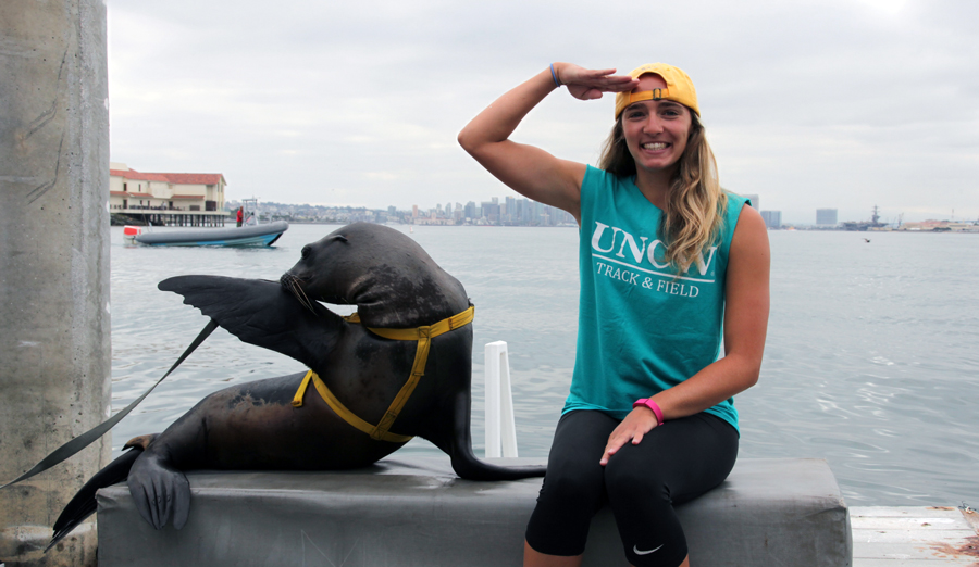 Samantha Cleary at harbor with seal
