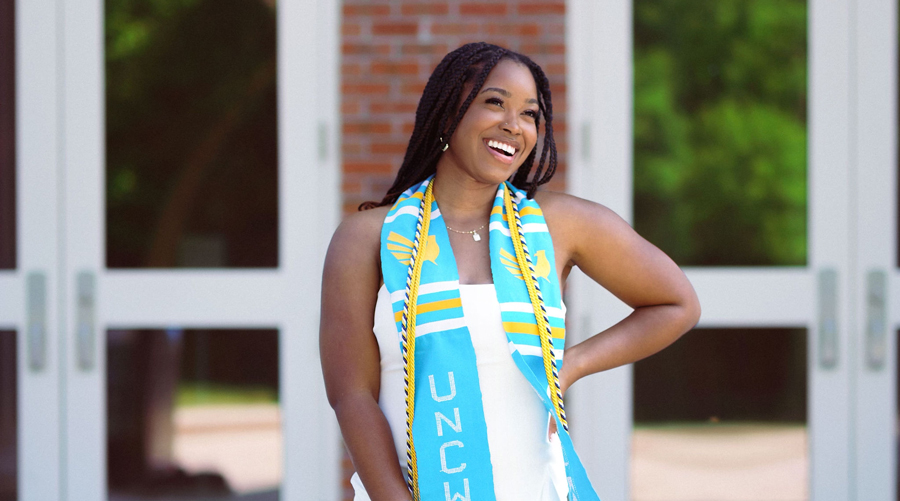 Sydney Johnson standing outside on campus